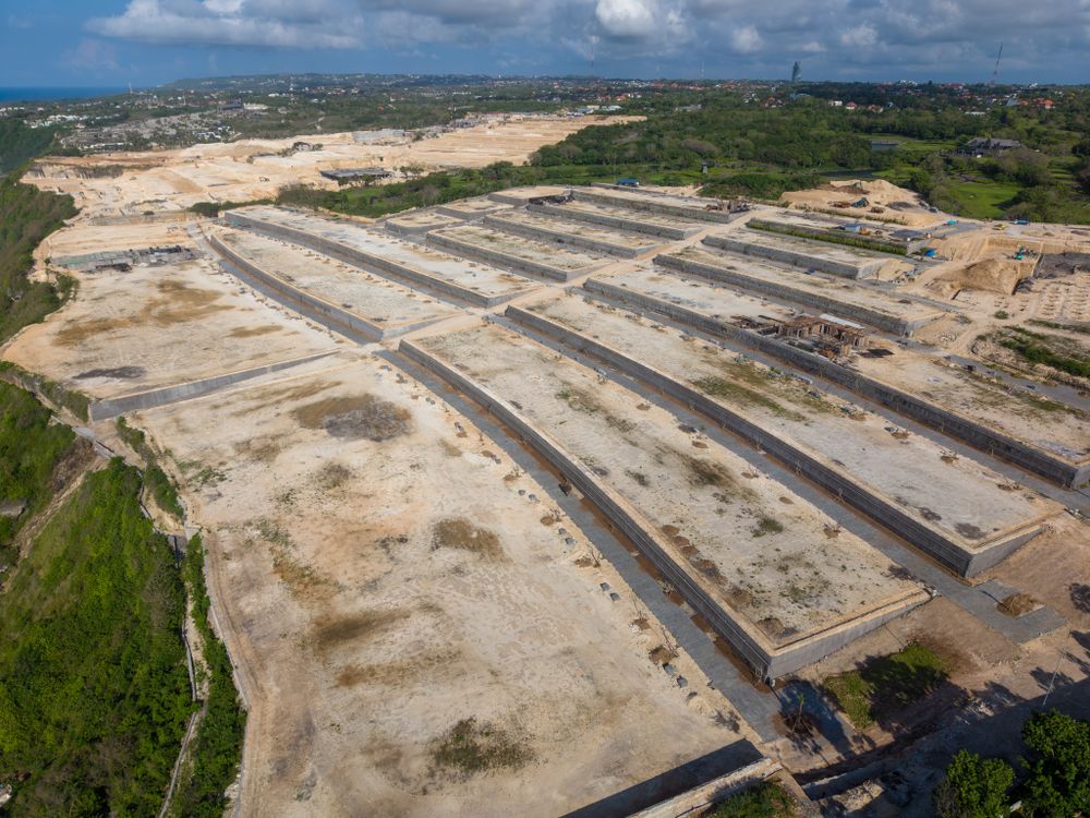 Levelled, walled residential plots on a hillside